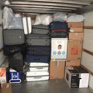 Crew unloading a storage container at a New Jersey home